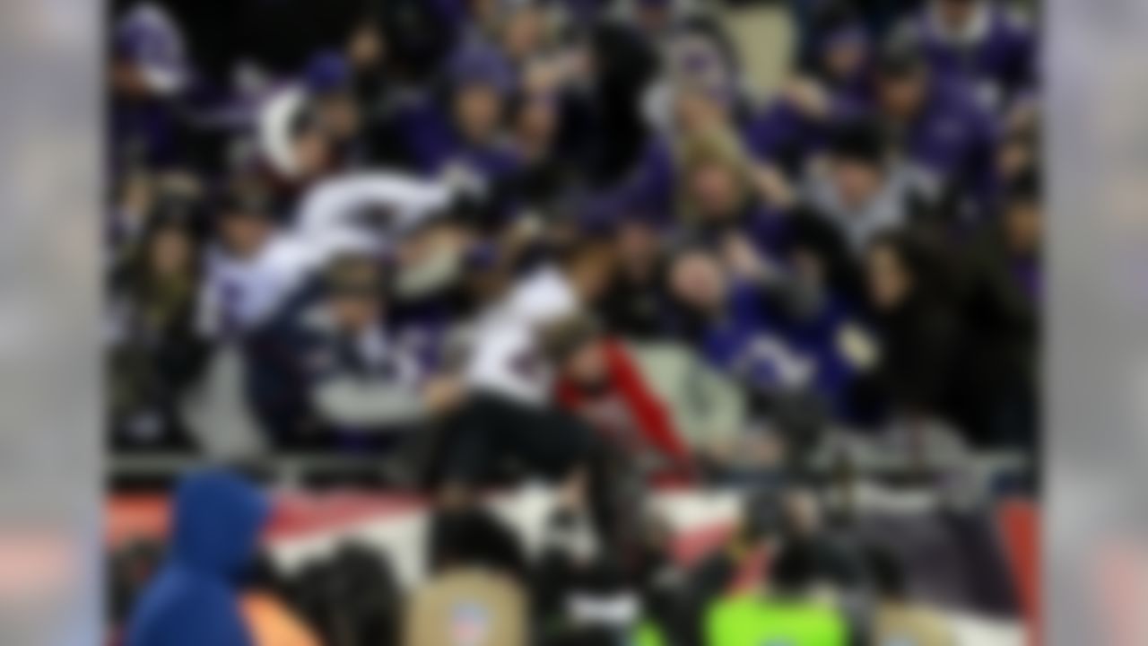 Baltimore Ravens running back Ray Rice celebrates with fans in the stands after the AFC Championship Game victory over the New England Patriots.  (Greg M. Cooper/US Presswire)