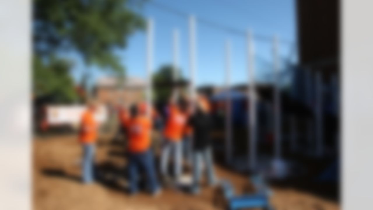 The Home Depot associates and KaBOOM! volunteers adding pieces to the new playground. (Photo by Tom Copeland/Home Depot)