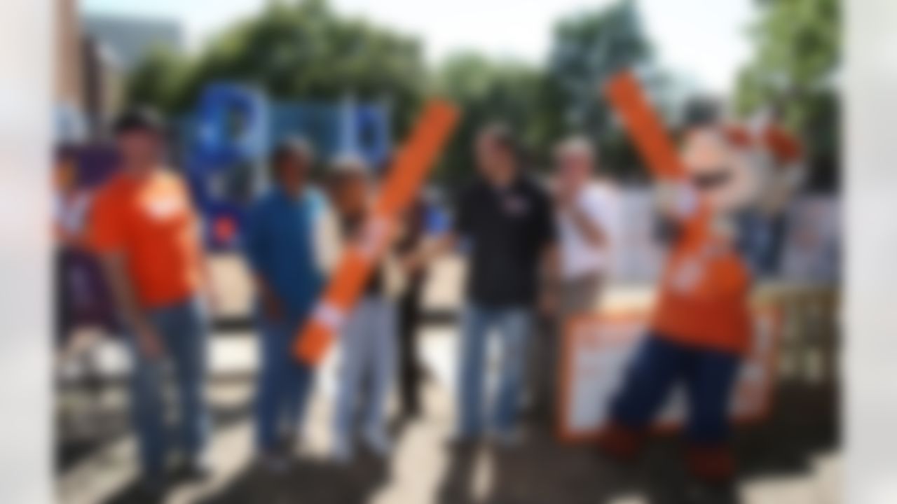 Mike Furrey and representatives from The Home Depot, KaBOOM! and Jop Preparatory Academy participate in the ceremonial board cutting. (Photo by Tom Copeland/Home Depot)