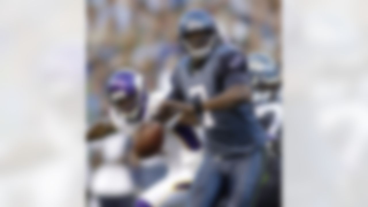 Seattle Seahawks quarterback Tarvaris Jackson looks to pass against the Minnesota Vikings in the first half of a preseason NFL football game, Saturday, Aug. 20, 2011, in Seattle. (AP Photo/Ted S. Warren)