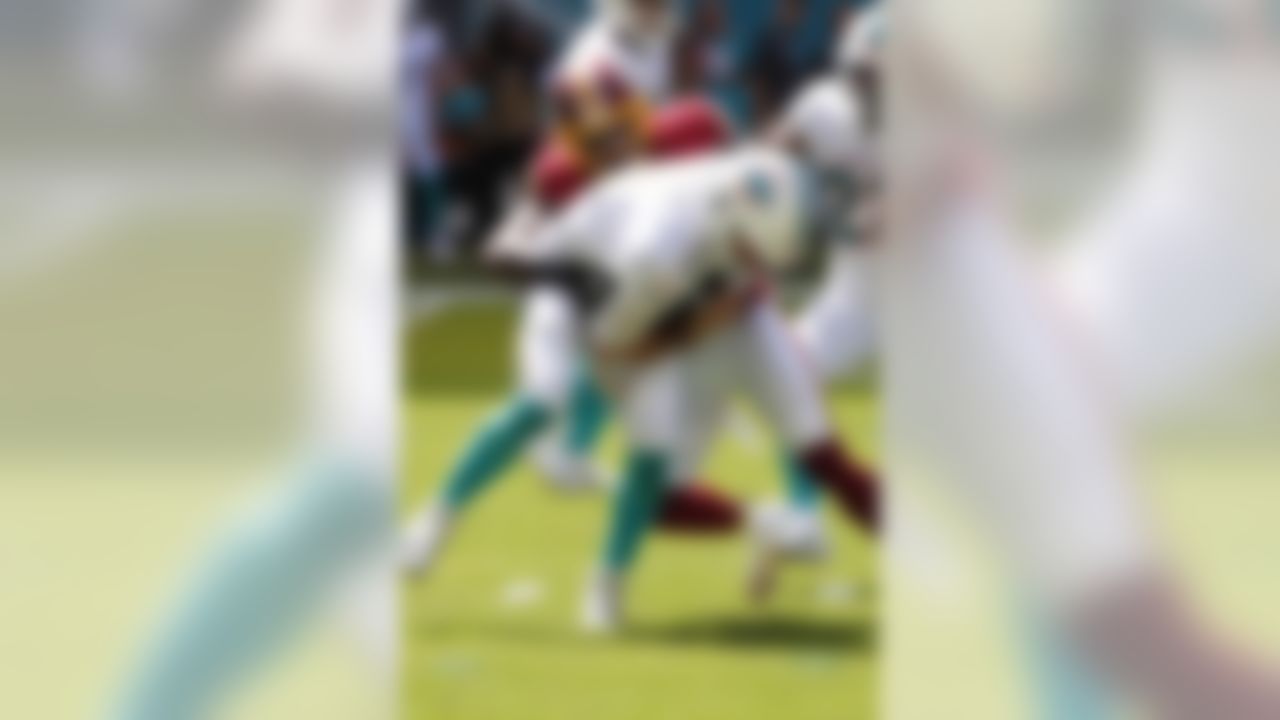 Washington Redskins strong safety Landon Collins (20) sacks Miami Dolphins quarterback Josh Rosen (3), during the first half at an NFL football game, Sunday, Oct. 13, 2019, in Miami Gardens, Fla. (AP Photo/Wilfredo Lee)