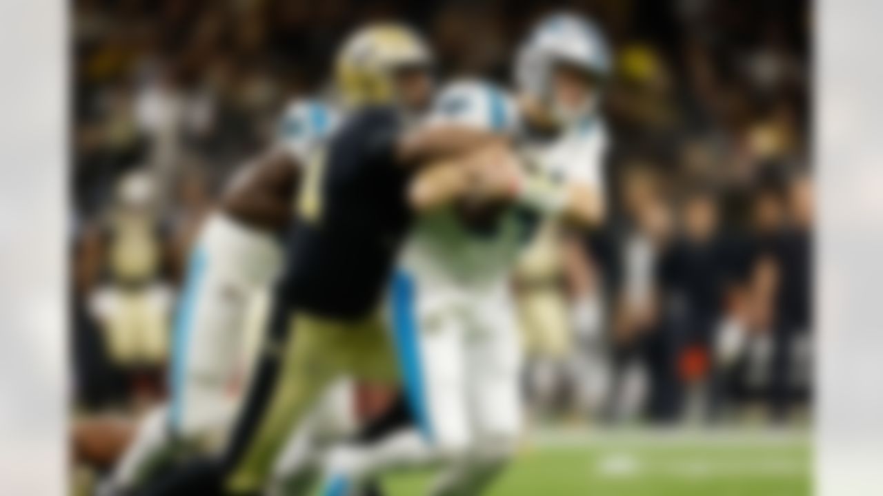 New Orleans Saints defensive end Cameron Jordan (94) tackles Carolina Panthers quarterback Sam Darnold (14) during an NFL football game on Sunday, January 2, 2022 in New Orleans, Louisiana.