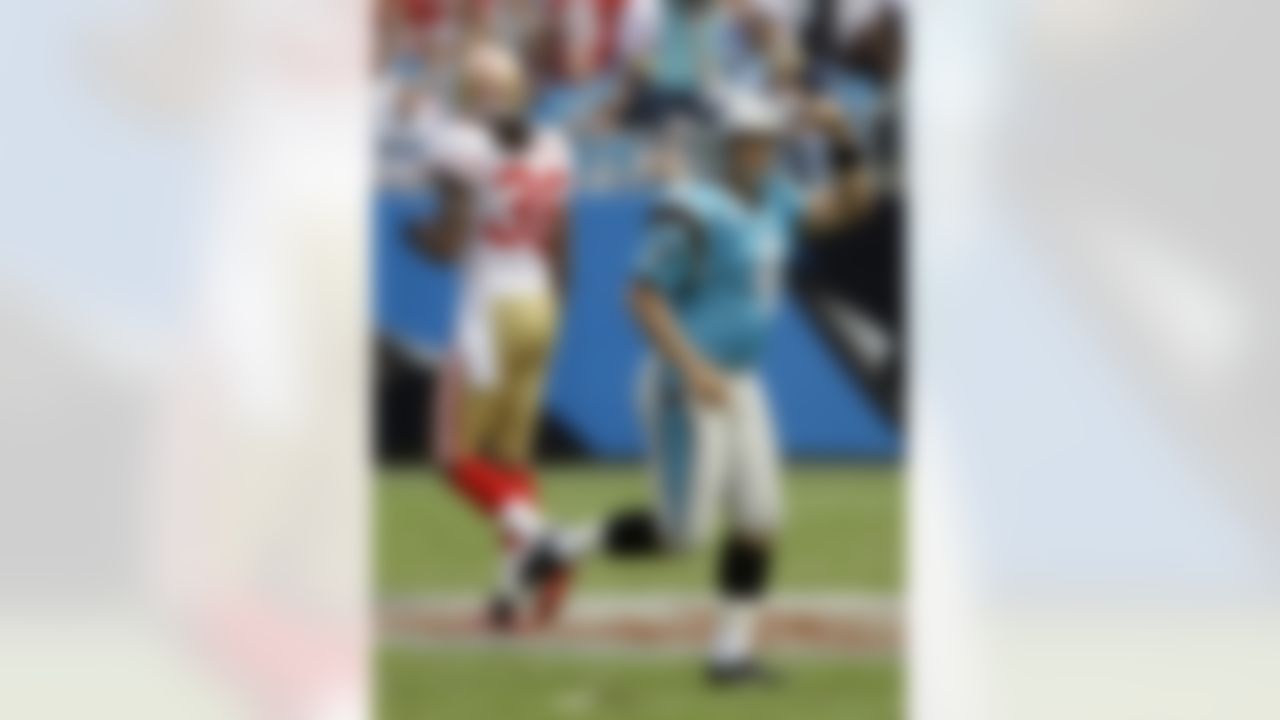Carolina Panthers place kicker John Kasay (4) reacts after making a field goal during the third quarter as San Francisco 49ers' Dashon Goldson (38) walks away in an NFL football game in Charlotte, N.C., Sunday, Oct. 24, 2010. (AP Photo/Rusty Burroughs)