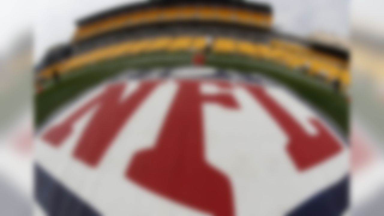 In this image made with a fisheye lens, the NFL logo is displayed on the sideline of Heinz Field as the Tennessee Titans warm up before an NFL football game against the Pittsburgh Steelers, Sunday, Sept. 8, 2013 in Pittsburgh. (AP Photo/Keith Srakocic)