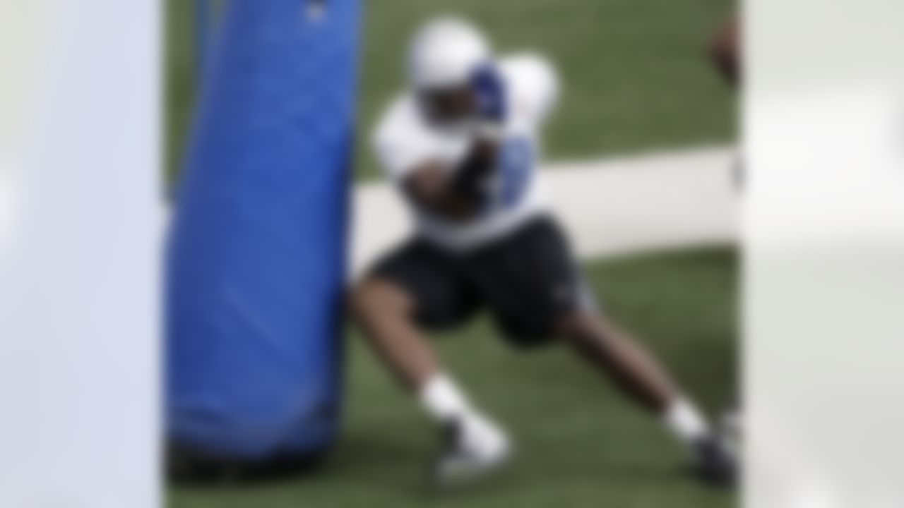 Detroit Lions defensive tackle Nick Fairley runs  a drill during their NFL football training camp practice at the teams indoor training facility in Allen Park, Mich., Friday, July 29, 2011. (AP Photo/Paul Sancya)