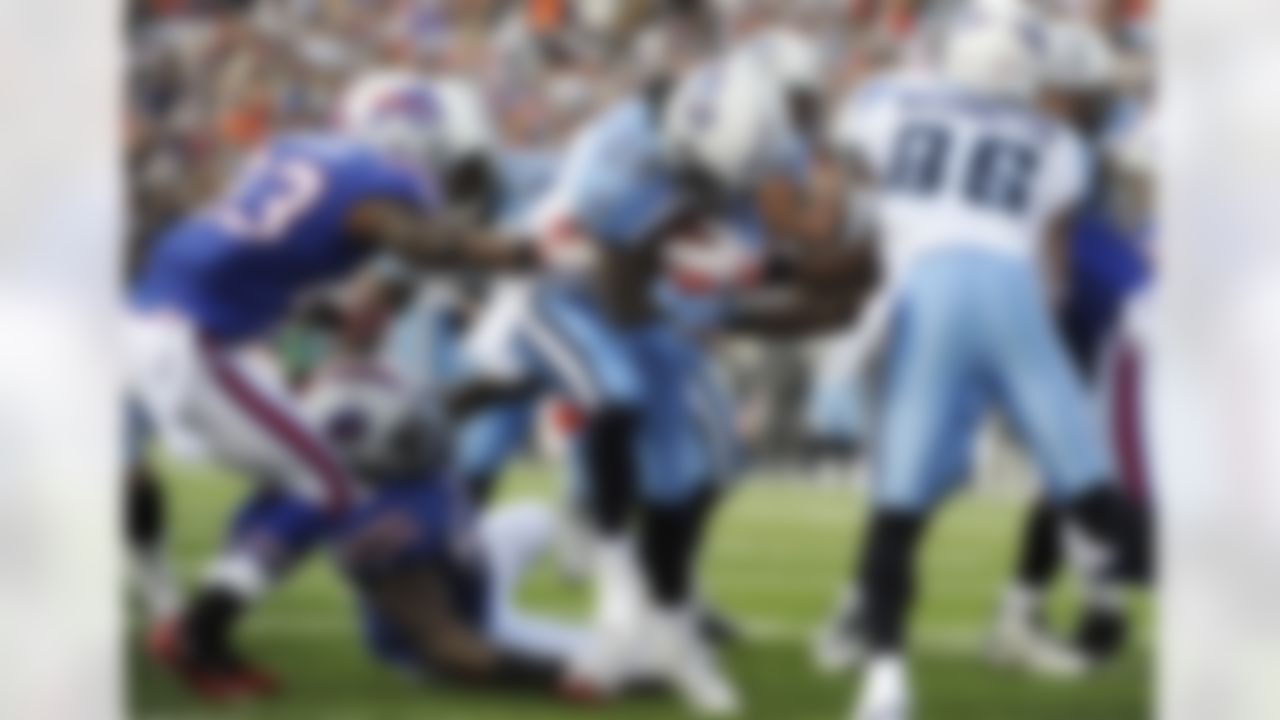 Tennessee Titans' Chris Johnson (28) runs for a touchdown against the Buffalo Bills during the first half of an NFL football game in Orchard Park, N.Y., Sunday, Dec. 4, 2011. (AP Photo/Gary Wiepert)