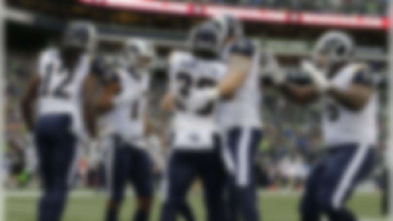 Los Angeles Rams running back Todd Gurley (30) celebrates with teammates after he scored touchdown against the Seattle Seahawks in the first half of an NFL football game, Sunday, Dec. 17, 2017, in Seattle. (AP Photo/John Froschauer)