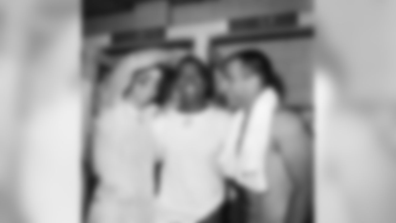 Three members of the Detroit Lions who played key roles in the club's 17-13 victory over the Green Bay Packers in the National Football League opener at Milwaukee County Stadium smile happily in the clubhouse after the game on Sept. 27, 1961. Left to right, quarterback Earl Morrall, who pitched a touchdown pass; Dick Lane, who snuffed out a late Green Bay threat with a pass interception, and Nick Pietrosante, who scored two touchdowns. (AP Photo)