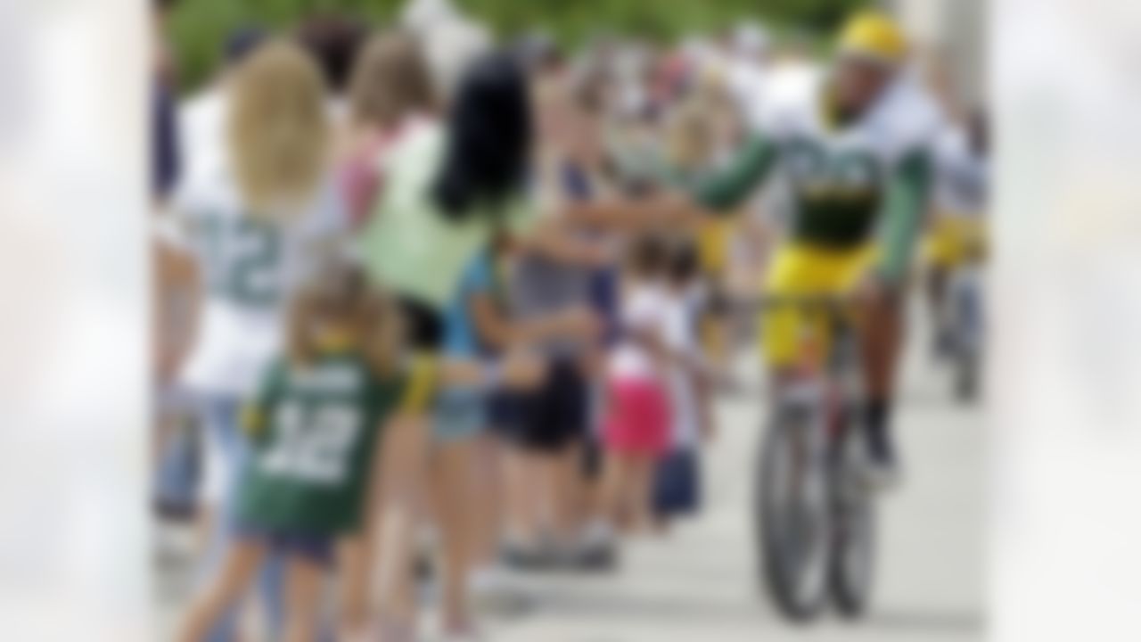 Green Bay Packers' Jermichael Finley rides a bike to NFL football training camp Monday, Aug. 2, 2010, in Green Bay, Wis. (AP Photo/Morry Gash)