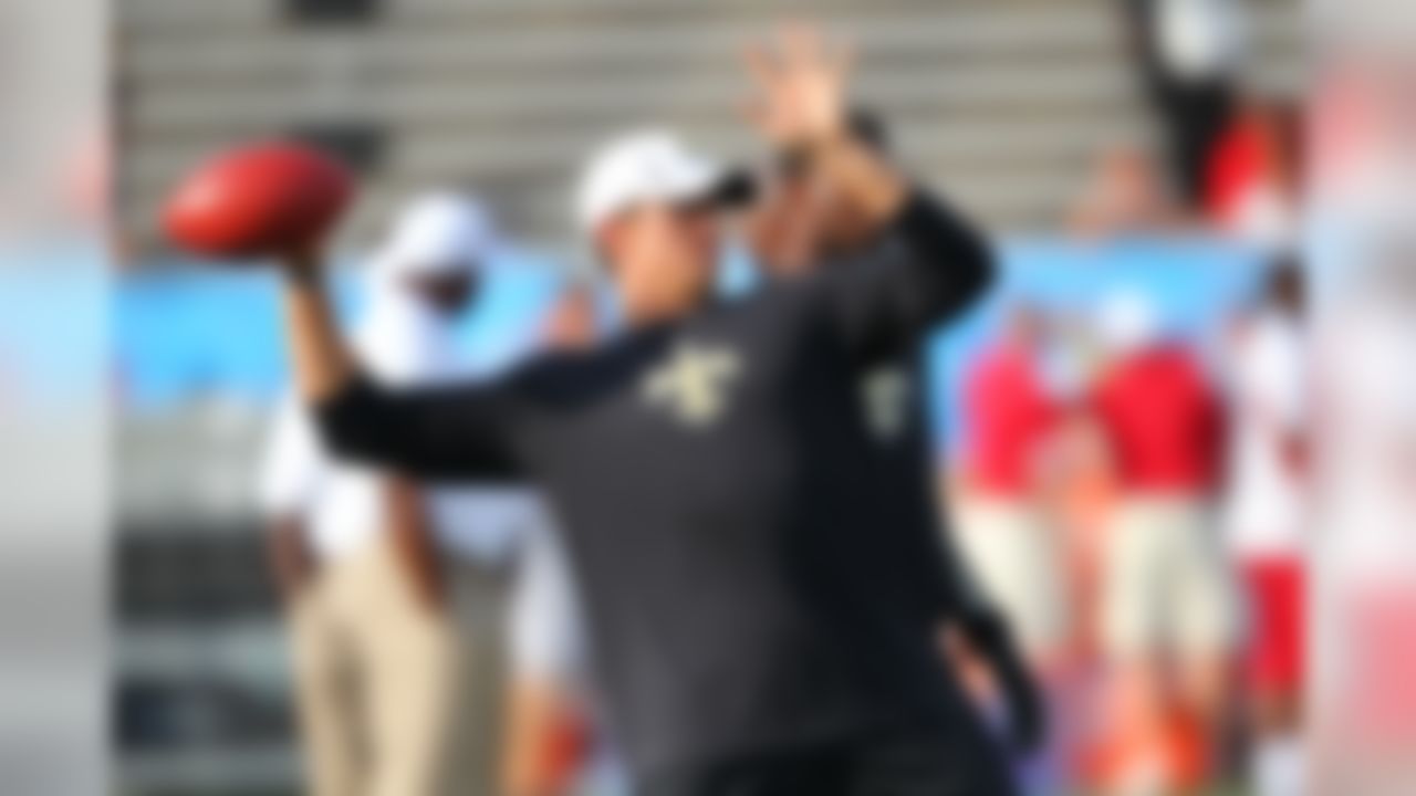 Quarterback Drew Brees #9 of the New Orleans Saints warms up before taking on the Arizona Cardinals in the 2012 Hall of Fame Game at Fawcett Stadium in Canton, Ohio on August 5, 2012.  (Ben Liebenberg/NFL)