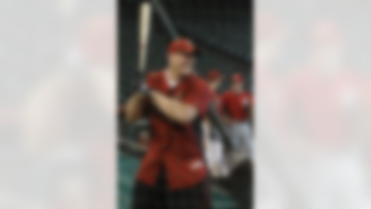 Houston Texans first-round NFL football draft pick J.J. Watt takes batting practice with the Houston Astros before a baseball game against the Washington Nationals, Tuesday, July 19, 2011, in Houston. (AP Photo/Pat Sullivan)