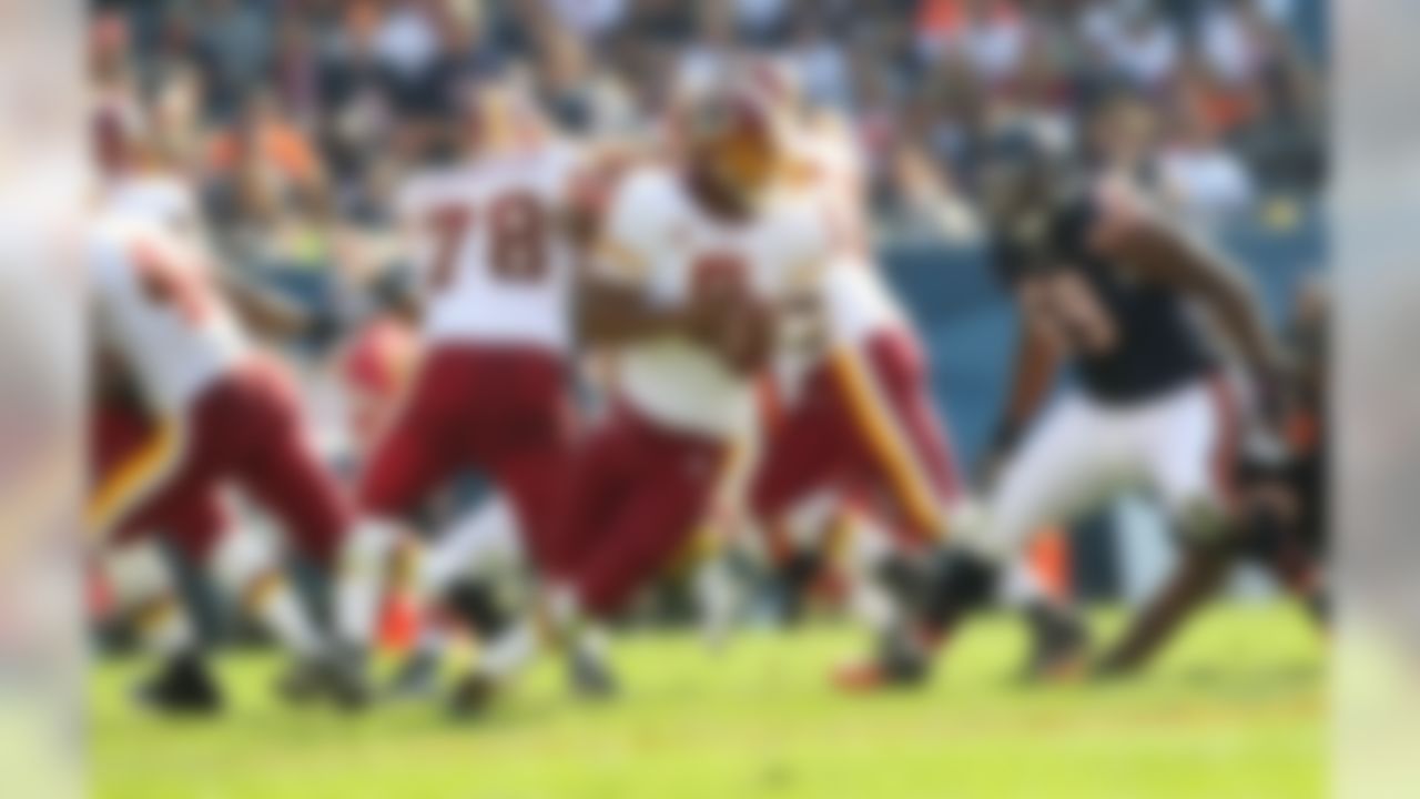 Washington Redskins quarterback Donovan McNabb (5) rolls out to pass against the Chicago Bears at Soldier Field in Chicago, Illinois on October 24, 2010. (Todd Rosenberg/NFL)