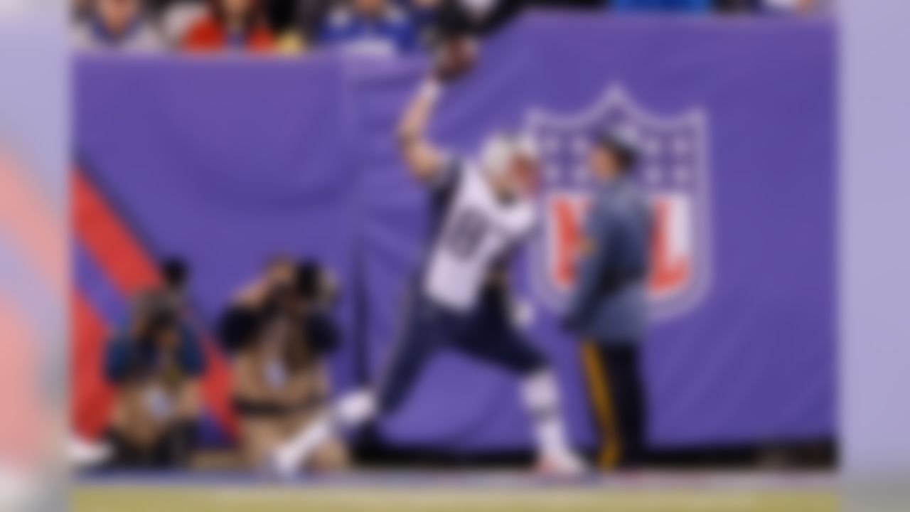 New England Patriots tight end Rob Gronkowski (87) spikes the ball in celebration of his touchdown catch during the NFL regular season game against the New York Giants on Sunday, Nov. 15, 2015 in East Rutherford, NJ. (Ric Tapia/NFL)