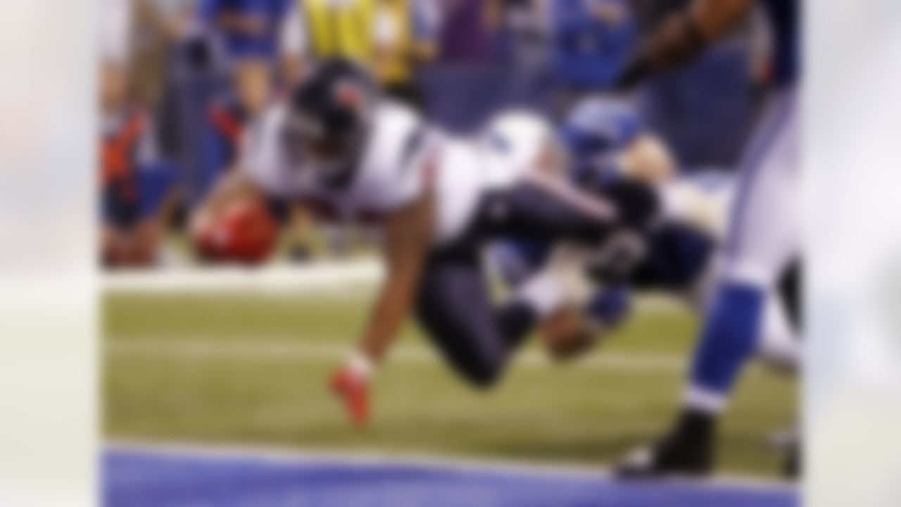 Houston Texans running back Arian Foster (23) dives for the end zone to score a fourth quarter touchdown on a 6 yard run that cuts the Indianapolis Colts lead to 27-17 during the NFL week 8 football game against the Indianapolis Colts on Monday, November 1, 2010 in Indianapolis, Indiana. The Colts won the game 30-17. (AP Photo/Paul Spinelli)