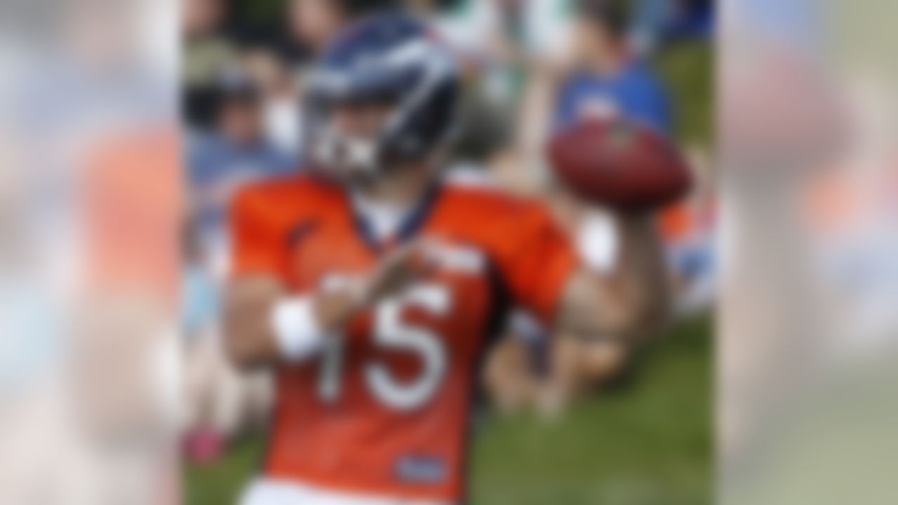 Denver Broncos quarterback Tim Tebow (15) throws a pass during NFL football training camp on Wednesday, Aug. 10, 2011, in Englewood, Colo. The Broncos are scheduled to play an exhibition game against the Cowboys in Dallas on Thursday. (AP Photo/Ed Andrieski)