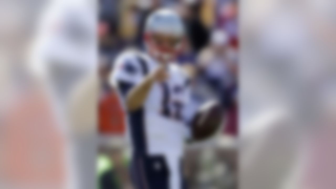 New England Patriots quarterback Tom Brady warms up before the start of an NFL football game against the Minnesota Vikings, Sunday, Sept. 14, 2014, in Minneapolis. (AP Photo/Jeff Roberson)