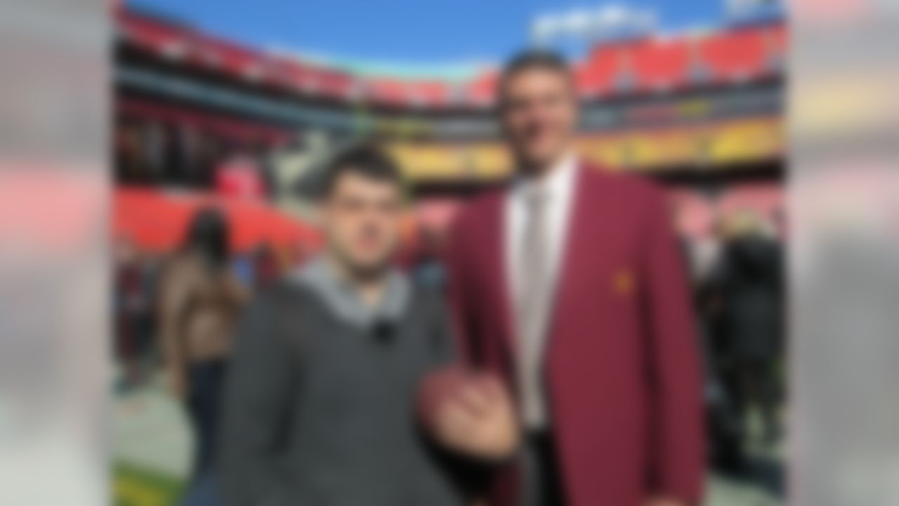 Zac Whinnem poses for a photograph with former Washington Redskins offensive tackle Jon Jansen. (National Football League)