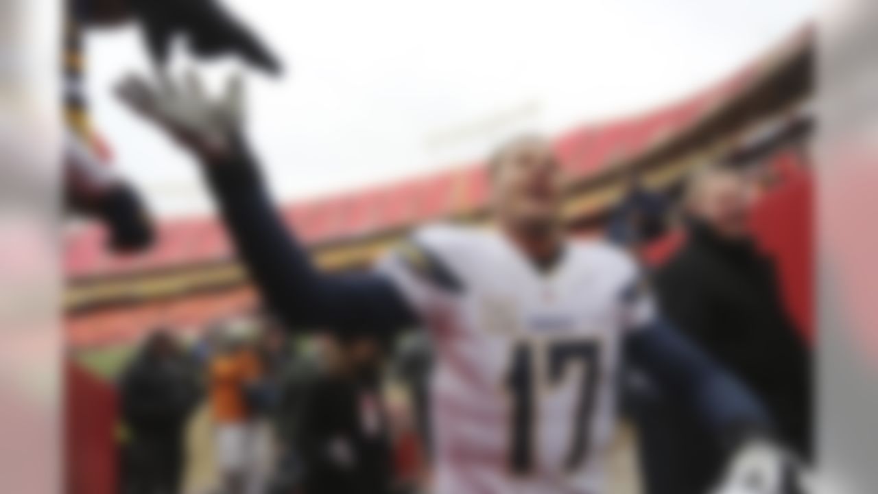 San Diego Chargers quarterback Philip Rivers (17) is congratulated by fans following an NFL football game against the Kansas City Chiefs in Kansas City, Mo., Sunday, Nov. 24, 2013. The Chargers won 41-38. (AP Photo/Ed Zurga)