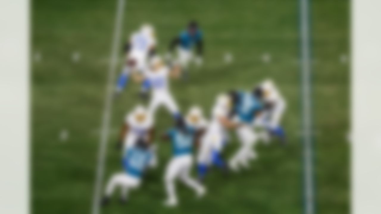 Los Angeles Chargers quarterback Justin Herbert (10) makes a throw in the pocket during an NFL Super Wild Card Weekend playoff game against the Jacksonville Jaguars on Saturday, January 14, 2023 in Jacksonville, Florida.