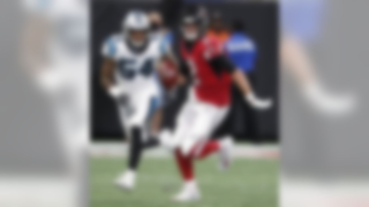 Atlanta Falcons quarterback Matt Ryan (2) runs out of the pocket as Carolina Panthers linebacker Shaq Green-Thompson (54) defends during the first half of an NFL football game, Sunday, Sept. 16, 2018, in Atlanta. (AP Photo/John Bazemore)