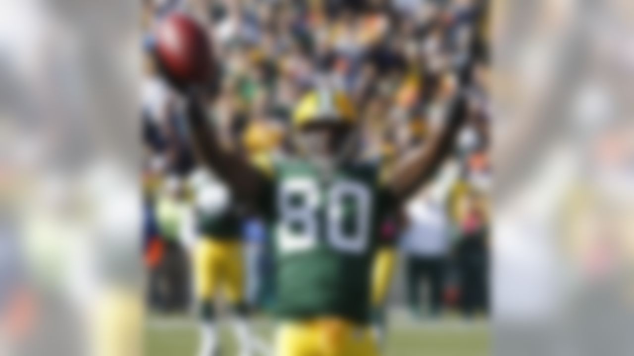 Green Bay Packers' Donald Driver celebrates his reception, to break the Packers' all-time receiving record, against the Detroit Lions during the first half of an NFL football game Sunday, Oct. 18, 2009, in Green Bay, Wis. (AP Photo/Jim Prisching)