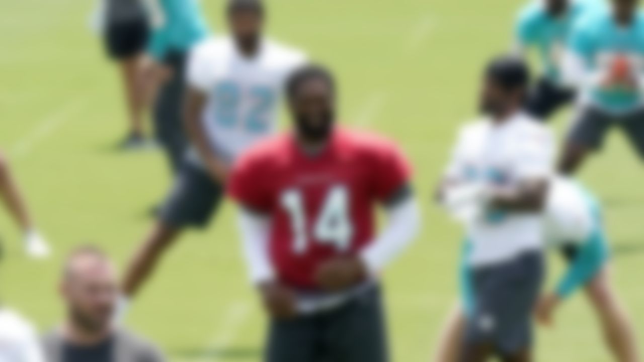 Miami Dolphins quarterback Jacoby Brissett (14) does drills at the team's NFL football training facility, Wednesday, May 26, 2021, in Davie, Fla.