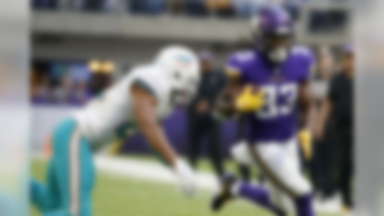 Minnesota Vikings running back Dalvin Cook, right, runs from Miami Dolphins strong safety T.J. McDonald, left, during the first half of an NFL football game, Sunday, Dec. 16, 2018, in Minneapolis. (AP Photo/Bruce Kluckhohn)