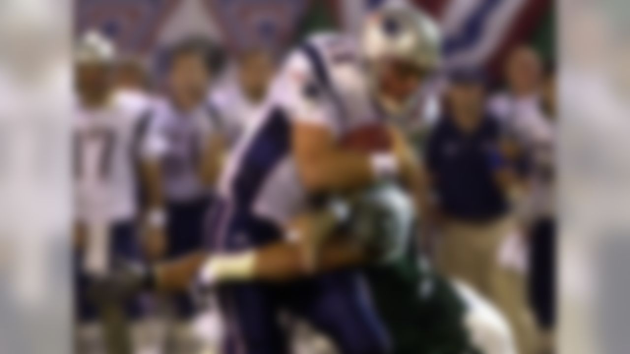 The Jets knock Drew Bledsoe out during the team's Week 2 meeting. The Patriots then turn things over to second-year quarterback Tom Brady. We all know how this ends, right? (AP Photo/Bill Kostroun)