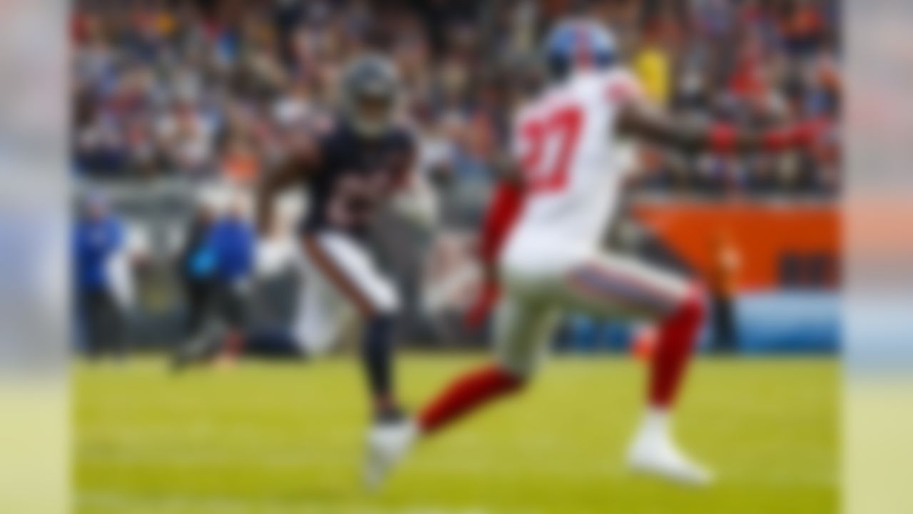 Chicago Bears running back Tarik Cohen (29) looks to get past New York Giants cornerback Deandre Baker (27)] during the first half of an NFL football game in Chicago, Sunday, Nov. 24, 2019. (AP Photo/Paul Sancya)