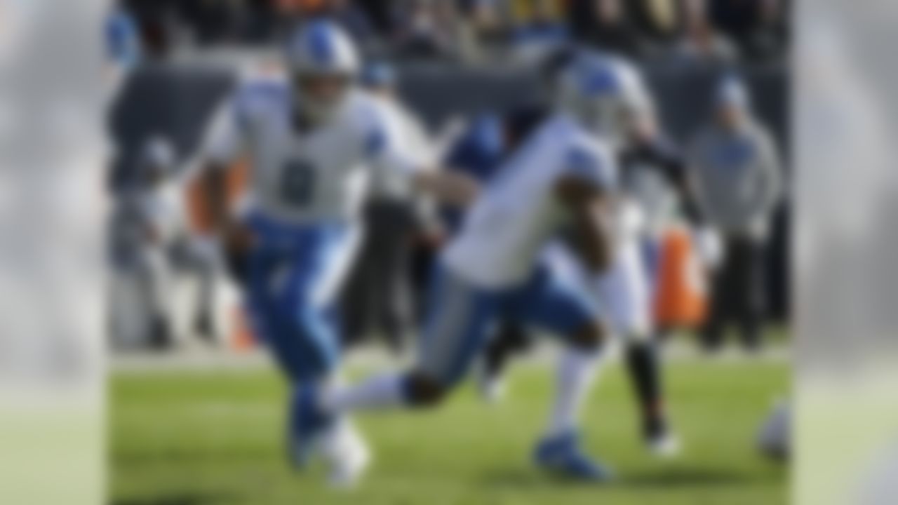 Detroit Lions quarterback Matthew Stafford (9) hands off the ball to running back Ameer Abdullah (21) during the first half of an NFL football game against the Chicago Bears, Sunday, Nov. 19, 2017, in Chicago. (AP Photo/Nam Y. Huh)