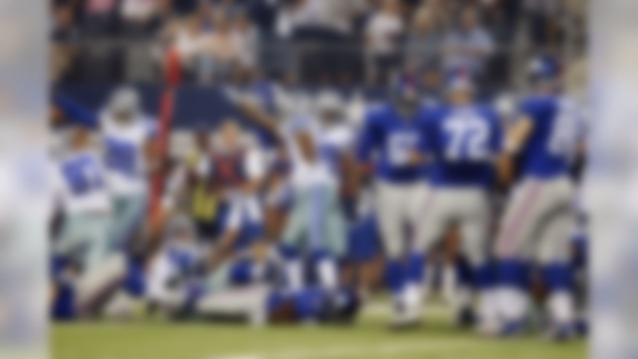 The Dallas Cowboys celebrate a fumble by New York Giants running back David Wilson (22) during the first half of an NFL football game, Sunday, Sept. 8, 2013, in Arlington, Texas. (AP Photo/LM Otero)