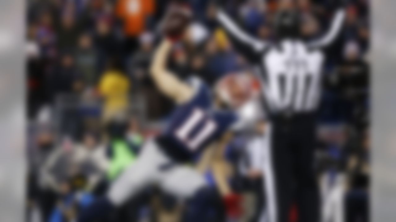 New England Patriots wide receiver Julian Edelman (11) spikes the ball after scoring a touchdown during an NFL football game against the Denver Broncos at Gillette Stadium on Sunday November 2, 2014 in Foxborough, Massachusetts. New England won 43-21. (Aaron M. Sprecher/NFL)