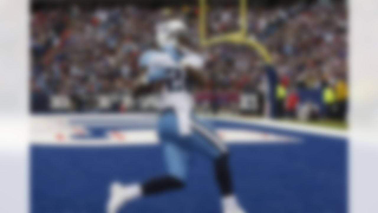 Tennessee Titans' Chris Johnson scores a touchdown against the Buffalo Bills during the first quarter of an NFL football game in Orchard Park, N.Y., Sunday, Dec. 4, 2011. (AP Photo/David Duprey)