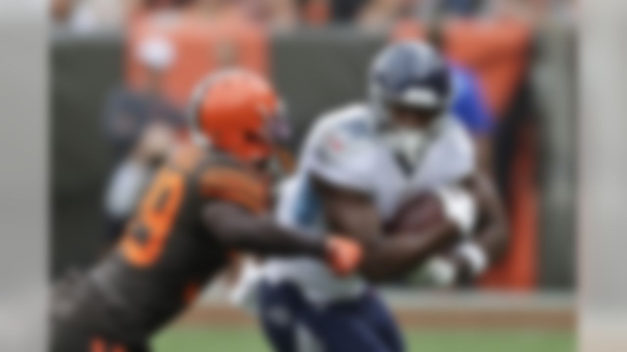 Cleveland Browns cornerback Terrance Mitchell (39) tackles Tennessee Titans tight end Jonnu Smith (81) after a pass reception during the first half in an NFL football game Sunday, Sept. 8, 2019, in Cleveland. (AP Photo/Ron Schwane)