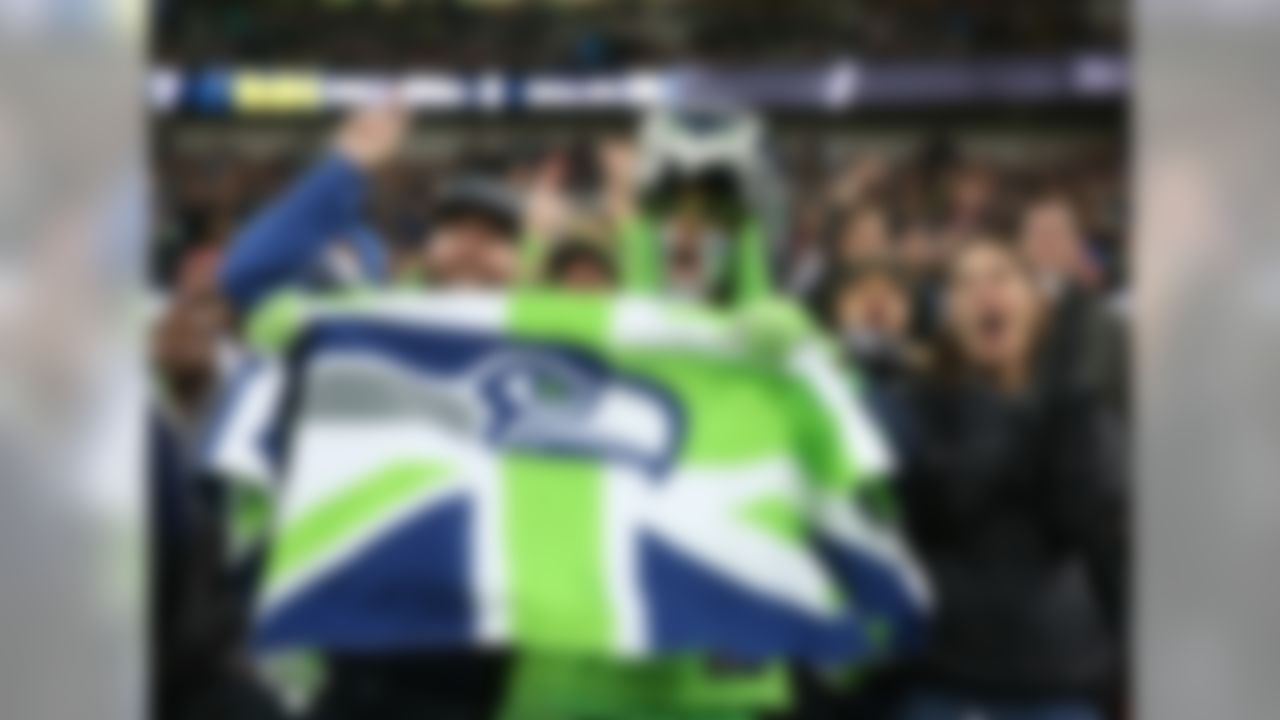 Seattle Seahawks fans cheer during an NFL football game against the Oakland Raiders at Wembley stadium in London, Sunday, Oct. 14, 2018.