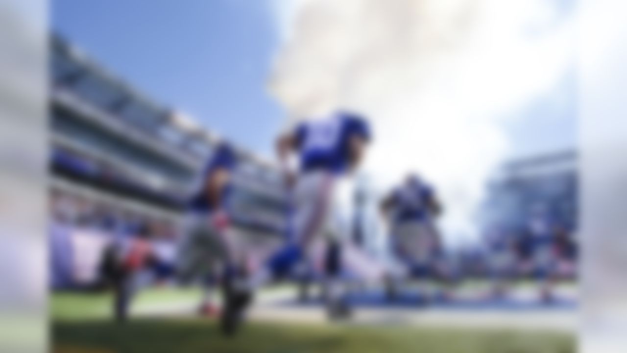 New York Giants quarterback Eli Manning (10) takes the field with teammates prior to an NFL football game against the Atlanta Falcons, Sunday, Oct. 5, 2014, in East Rutherford, N.J. (AP Photo/Kathy Willens)