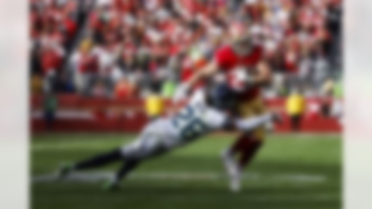 San Francisco 49ers running back Christian McCaffrey (23) runs the ball during an NFL Super Wild Card Weekend playoff game against the Seattle Seahawks on Saturday, January 14, 2023 in Santa Clara, California.