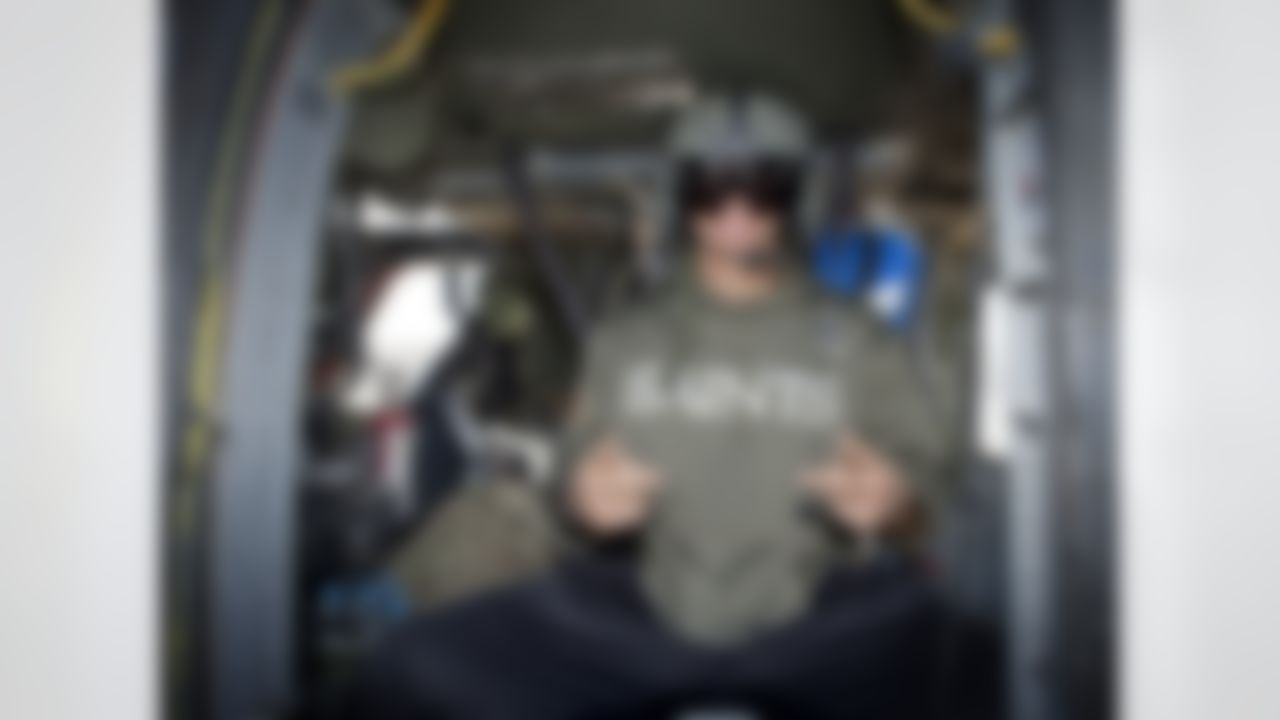 Jimmy Graham of the New Orleans Saints sits inside a medical rescue Blackhawk helicopter as part of his six-day USO/NFL tour to the Middle East on March 5, 2014. Graham, an avid pilot himself, is in the region with Brandon Fields of the Miami Dolphins and Pierre Garcon of the Washington Redskins to help the USO make �Every Moment Count� with troops. (USO Photo by Dave Gatley)