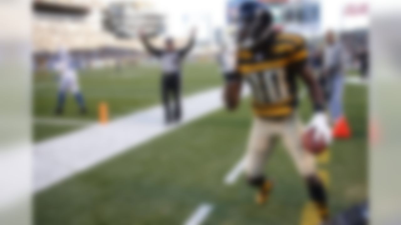 Pittsburgh Steelers wide receiver Markus Wheaton (11) gets up after making a catch as the official signals a touchdown and Indianapolis Colts free safety Darius Butler (20) walks away in the first quarter of an NFL football game, Sunday, Oct. 26, 2014, in Pittsburgh. (AP Photo/Gene Puskar)