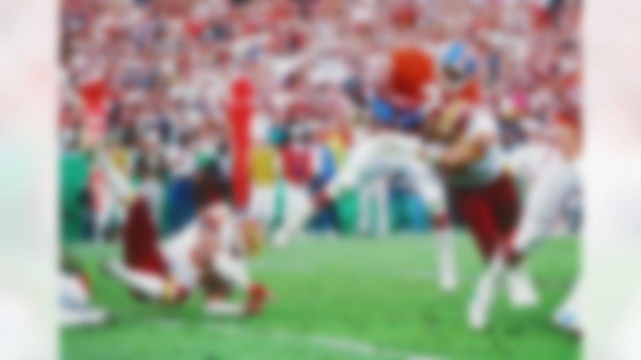 Denver Broncos running back Ken Bell (35) is hit hard during Super Bowl XXII between the Washington Redskins and the Denver Broncos on January 31, 1988 in San Diego, CA. (AP Photo/Paul Spinelli)