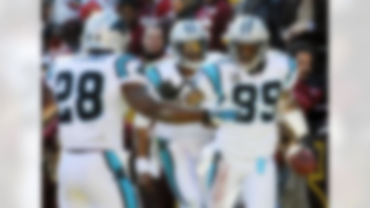 Carolina Panthers wide receiver Steve Smith (89) celebrates with running back Jonathan Stewart (28) and quarterback Cam Newton (1) after Smith's touchdown during the first half of an NFL football game against the Washington Redskins, Sunday, Nov. 4, 2012, in Landover, Md. (AP Photo/Richard Lipski)