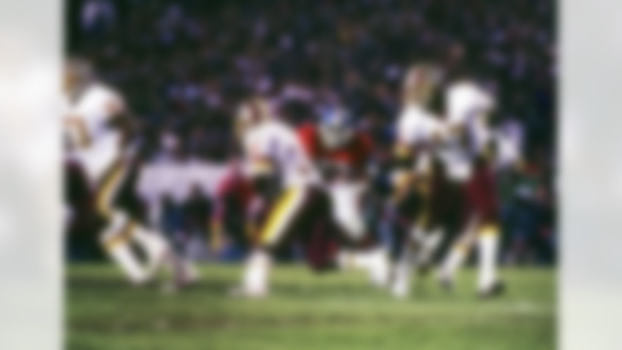 Washington Redskins quarterback and game MVP Doug Williams (17) hands off to running back Timmy Smith (36) during Super Bowl XXII, a 42-10 victory over the Denver Broncos on January 31, 1988, at Jack Murphy Stadium in San Diego, CA. (National Football League)