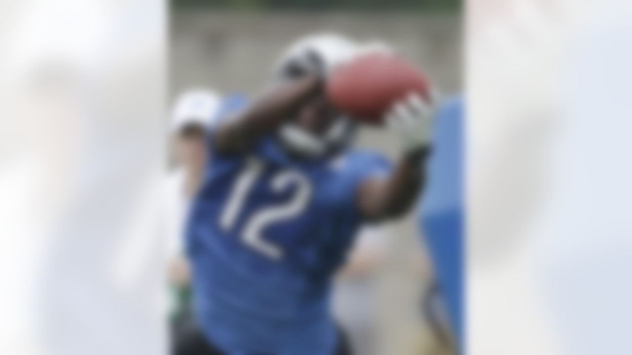 Detroit Lions receiver Dominique Barnes catches a pass during drills at NFL football training camp in Allen Park, Mich., Wednesday, Aug. 3, 2011. (AP Photo/Carlos Osorio)