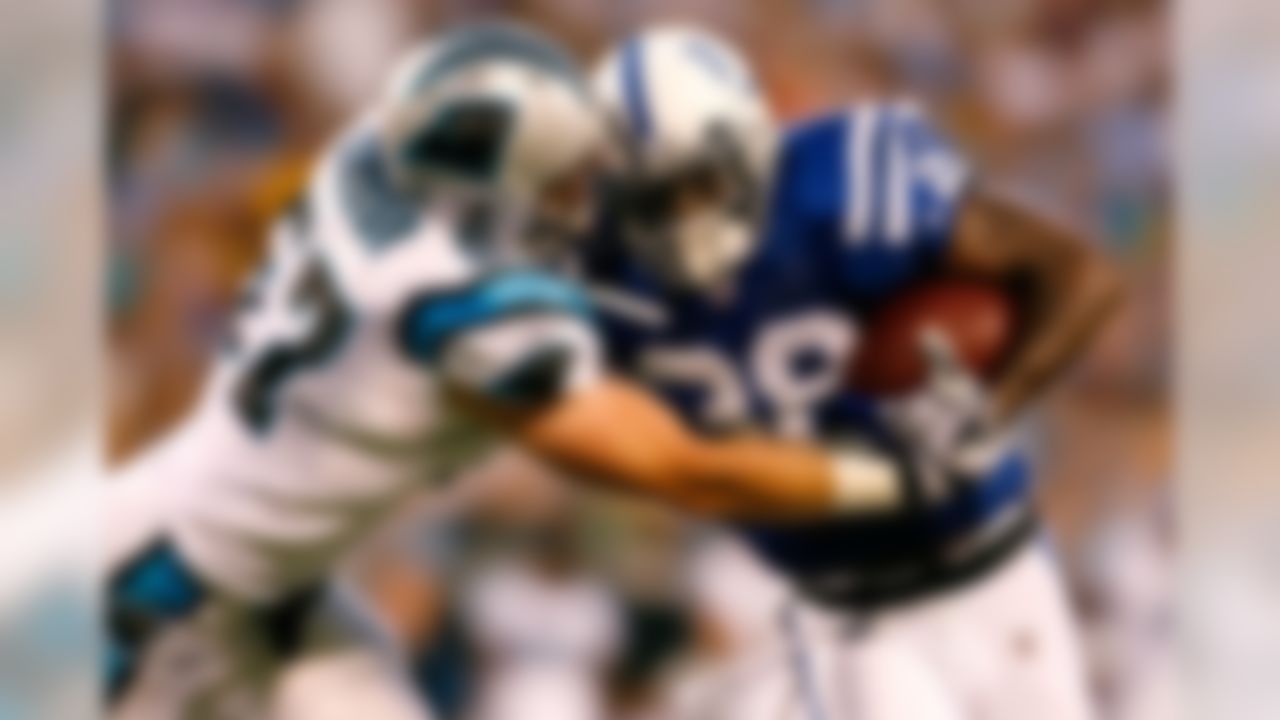 CHARLOTTE, NC - AUGUST 09:  Linebacker Dan Connor #57 of the Carolina Panthers tackles running back Dominic Rhodes #38 of the Indianapolis Colts during their game at Bank of America Stadium on August 9, 2008 in Charlotte, North Carolina.  (Photo by Kevin C. Cox/Getty Images)