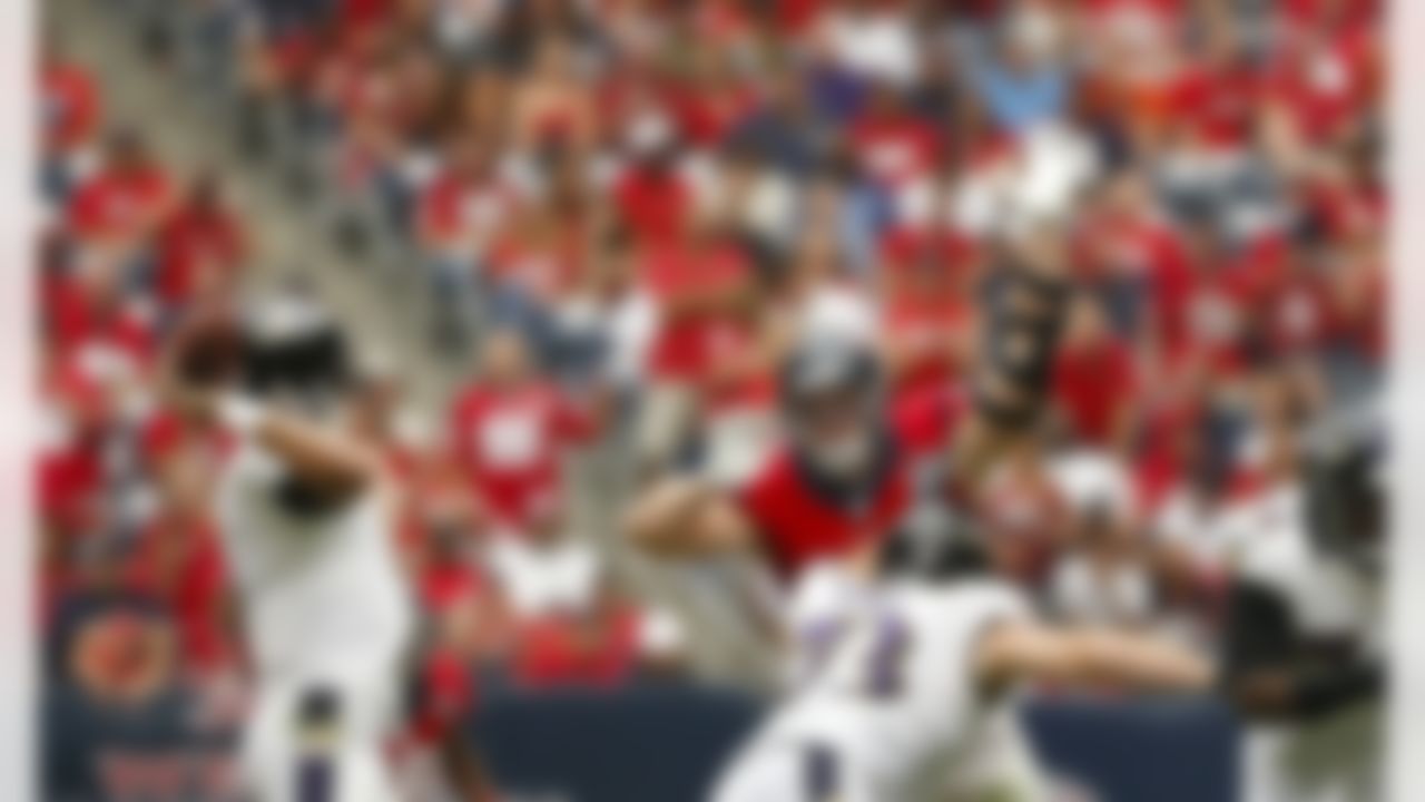 Houston Texans defensive end J.J. Watt (99) tries to deflect a pass from Baltimore Ravens quarterback Joe Flacco (5) during an NFL football game at Reliant Stadium on Sunday October 21, 2012 in Houston, Texas. Houston won 43-13. (AP Photo/Aaron M. Sprecher)