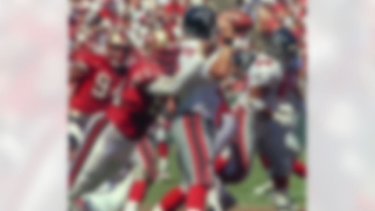 San Francisco 49ers linebacker Chris Doleman rushes Atlanta Falcons quarterback Billy Joe Tolliver during a 34-7 49ers victory in 1997. (AP Photo/Al Golub)