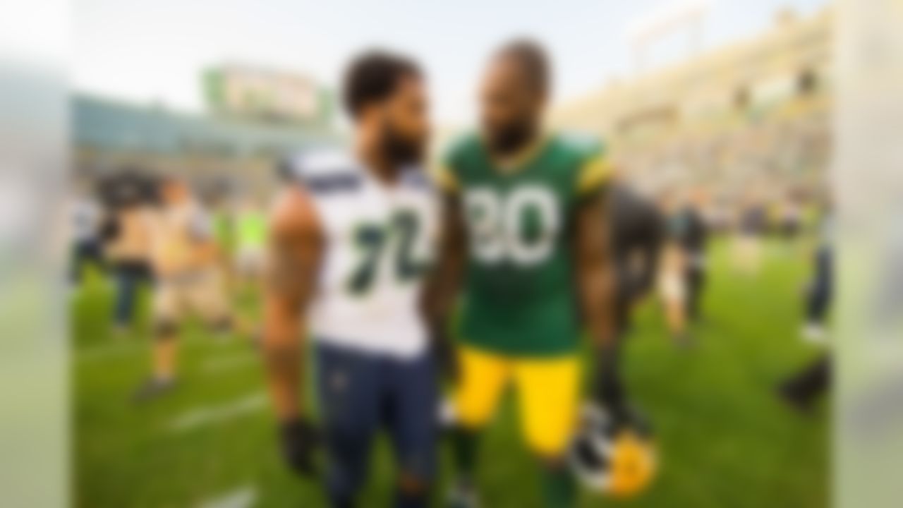 Seattle Seahawks defensive end Michael Bennett (72) and his brother Green Bay Packers tight end Martellus Bennett (80) talk following a NFL football game during week 1 on Sunday, September 10, 2016 at Lambeau Field in Green Bay. The Packers beat the Seahawks 17-9 (Todd Rosenberg/NFL)