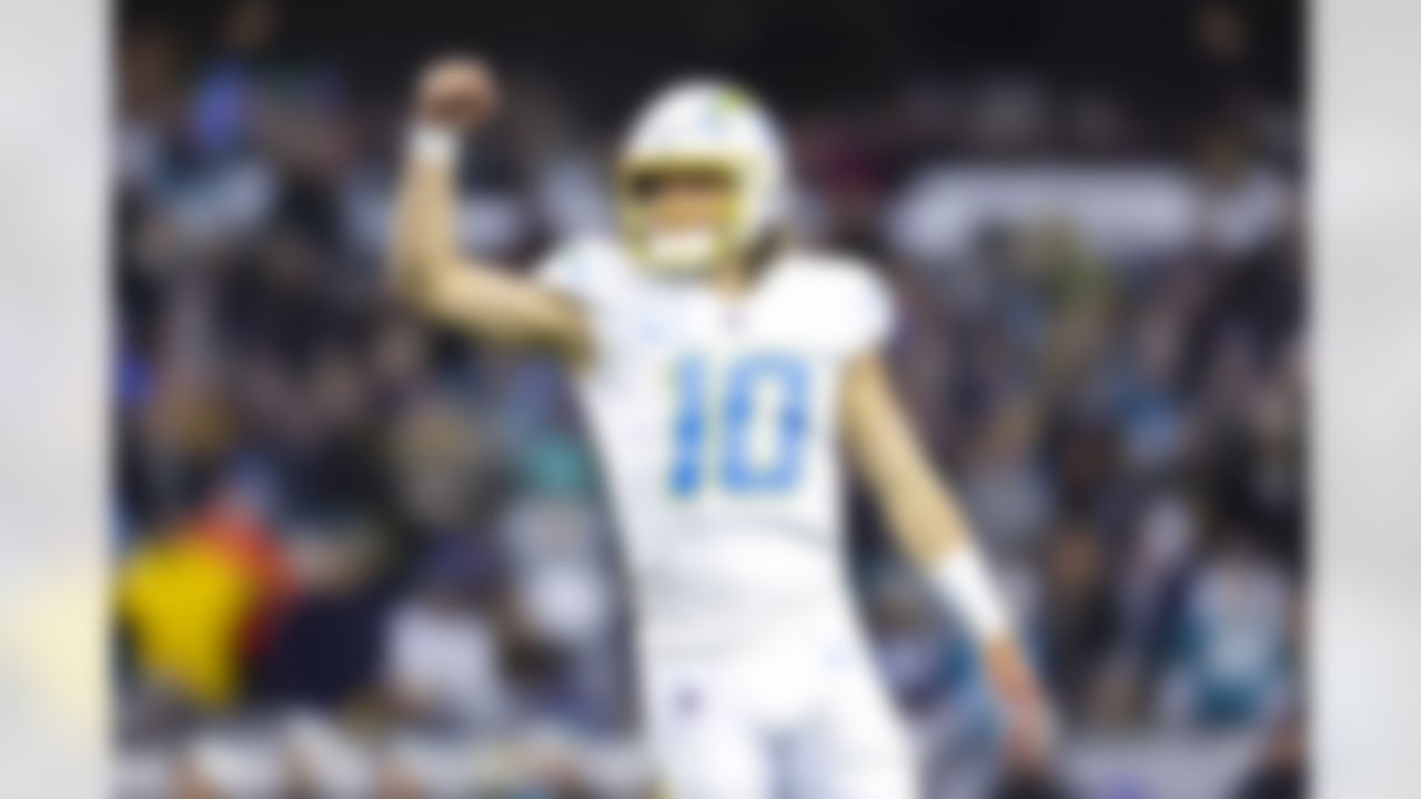 Los Angeles Chargers quarterback Justin Herbert (10) celebrates during an NFL Super Wild Card Weekend playoff game against the Jacksonville Jaguars on Saturday, January 14, 2023 in Jacksonville, Florida.