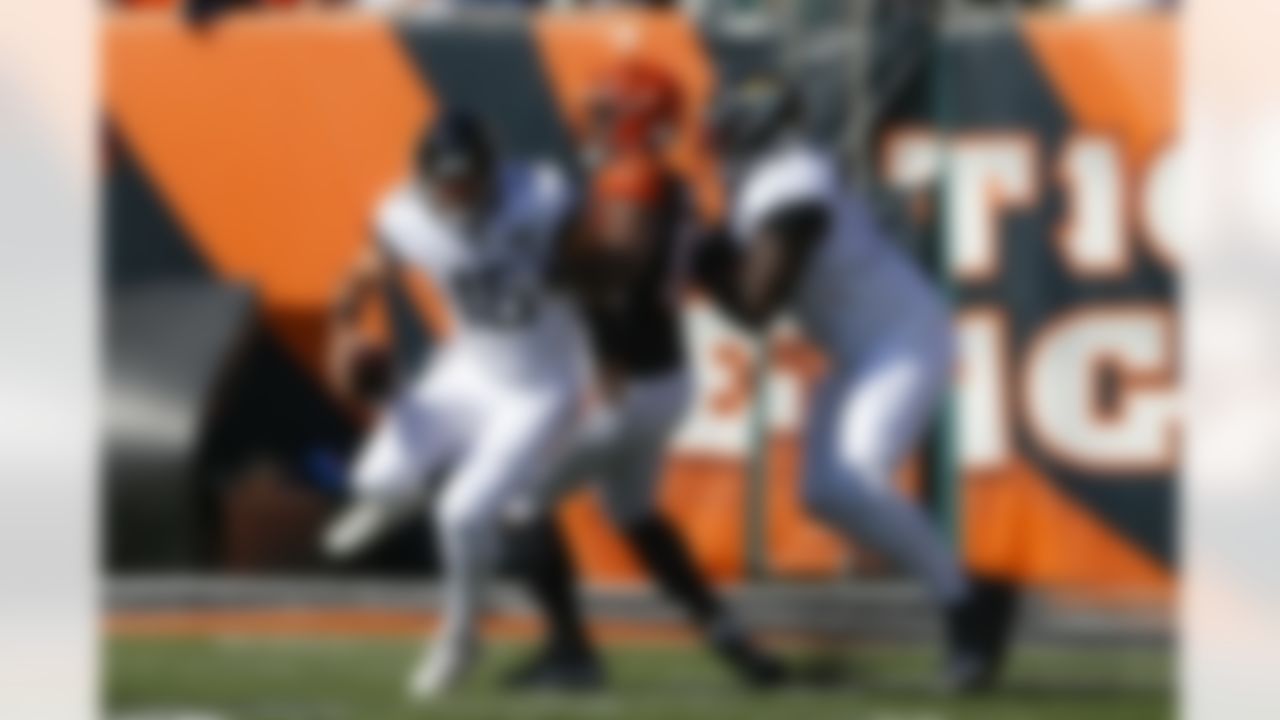 Jacksonville Jaguars quarterback Gardner Minshew (15) is sacked by Cincinnati Bengals defensive tackle Geno Atkins, center, in the first half of an NFL football game, Sunday, Oct. 20, 2019, in Cincinnati. (AP Photo/Gary Landers)