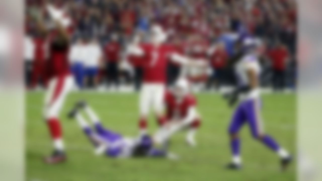 Arizona Cardinals kicker Chandler Catanzaro (7) watches his field goal split the uprights as Drew Butler (2) holds and Minnesota Vikings cornerback Marcus Sherels (35) tries to block during the second half of an NFL football game, Thursday, Dec. 10, 2015, in Glendale, Ariz. (AP Photo/Ross D. Franklin)